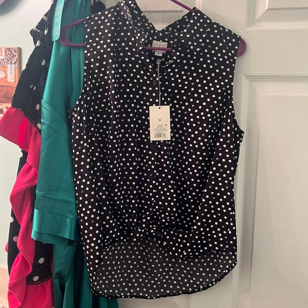 New with tags. Never worn. Medium polka dot sleeveless top